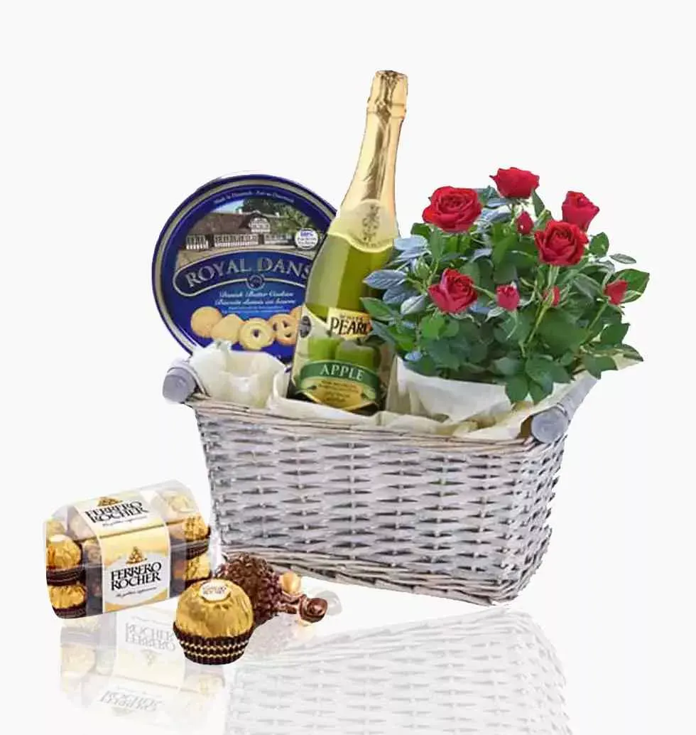 Basket Of Sweet Assortments With Red Roses