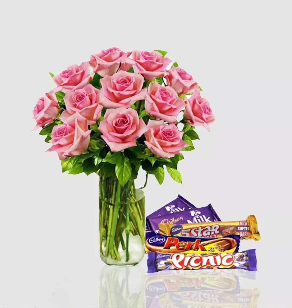 Pink Roses In Vase With Chocolates